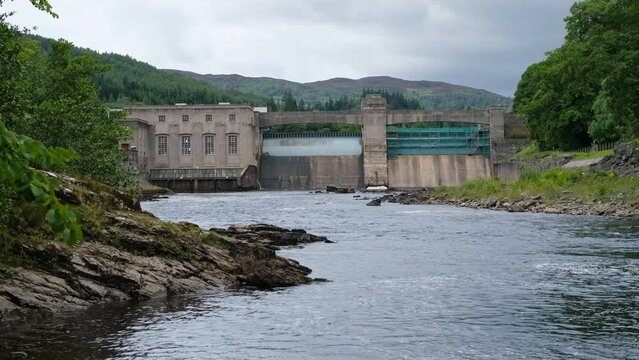 A rocky River Tummel and Pitlochry Dam during a summer in Pitlochry, Scotland