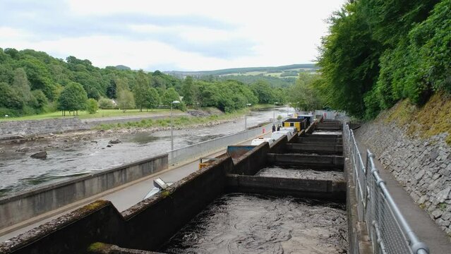 Pools or chambers with flowing water in the salmon ladder at Pitlochry dam