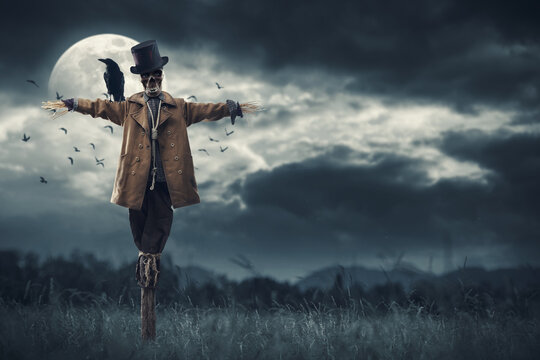 Creepy scarecrow and full moon