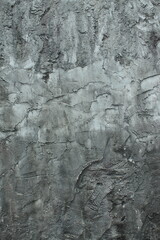 Old dark concrete wall as background. Horror background