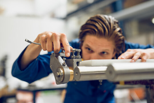 Professional craftsman fixing machine with tool in factory
