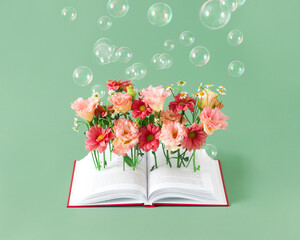 Open book with pink flowers. read books concept. Cover for library