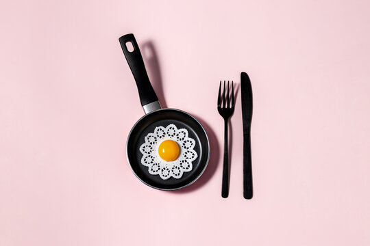 Fototapeta art print. breakfast fried eggs in pan. cover. cooking. minimalism