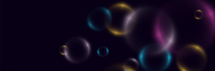 Abstract background with neon bubbles, iridescent colorful glass balls or spheres on a black background.