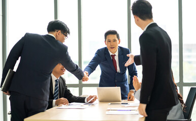 Image two business partner meeting successful handshake together with success join congratulation good deal contract in modern office.Partnership approval and teamwork concept