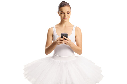 Ballerina in a white dress using a smartphone