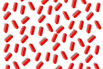 Red capsules. Lots of pills. on isolated transparent background