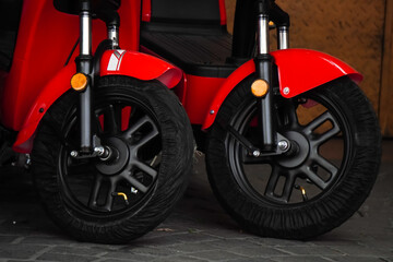 Brand new electric scooter motorbikes tires or wheels are for sale to customers. Electric motorbike shop. Concept for renewable energy, global warming.