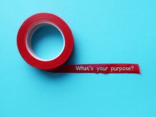 Red tape on copy space blue background with handwritten text - What’s your purpose? - to discover...