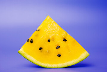 Fresh yellow watermelon slice on background, juicy delicious cut watermelon with a yellow core