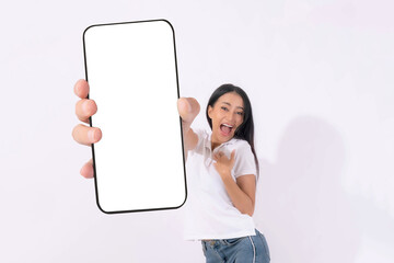 portrait of Beautiful Asian brunette woman cute girl in white shirt,Excited surprised girl showing big smart phone with blank screen , white screen isolated on white background