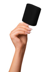 A woman's hand holds a black bluetooth music speaker. on isolated transparent background