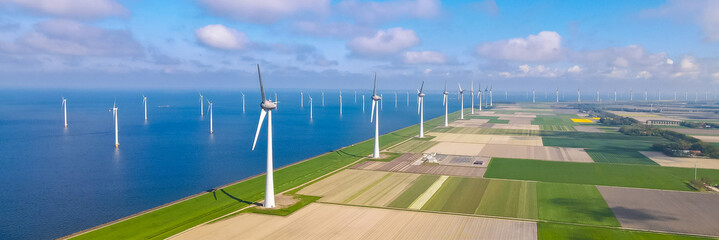 Windmill farm in the ocean Westermeerwind park, windmills isolated at sea on a beautiful bright...