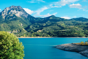 Lake of Serre-Poncon, reservoir and popular nature attraction on the border in the...