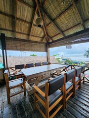 outdoor restaurant with wooden chairs and tables
