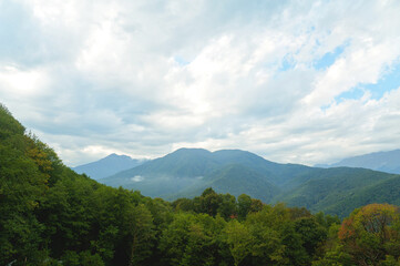 Fototapeta premium Beautiful view from the heights of mountains with clouds.