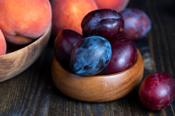 Ripe plums on the table in the kitchen