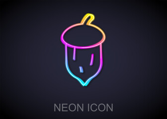 Glowing neon line Acorn, oak nut, seed icon isolated on black background. Vector