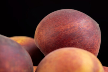 ripe delicious and fresh peaches of a red hue