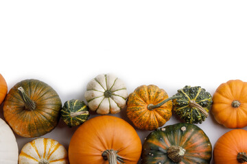 Autumn frame of pumpkins on white