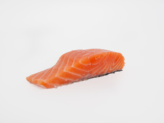 Salmon fish fillet on a white background. Red fish fillet close-up.