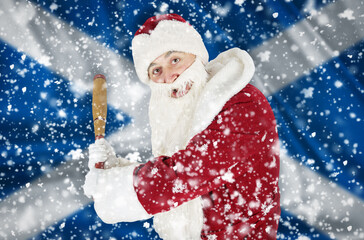 Santa Claus aggressively threatens with a bat against the backdrop of falling snow and the flag of...