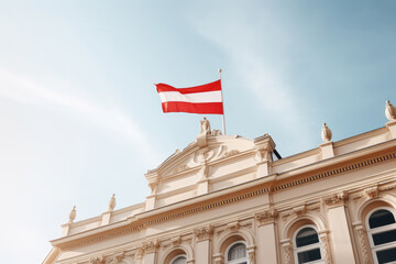 Fototapeta na wymiar Austrian National Day. Austrian Flag Waving On Top Of A Building Against Blue Sky. Ai Generated