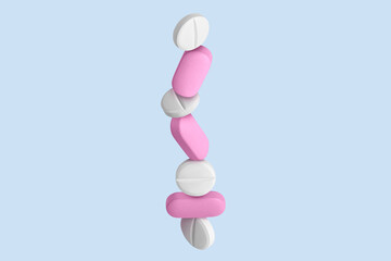 Pink capsules, pills and tablets. On.blue background.