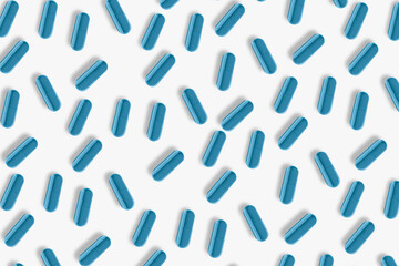 Blue pills and tablets. On a light background.