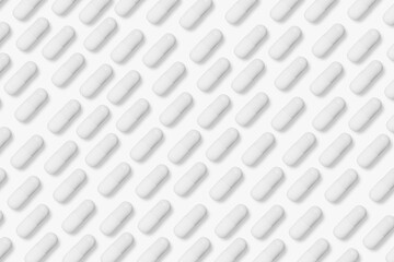 White tablets and pills. On a light background.