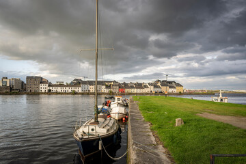 boat anchored in Eglinton Canal Sea Lock, The Long Walk, Galway, Ireland, United Kingdom