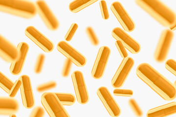 Yellow pills and tablets. They fly. On a light background.