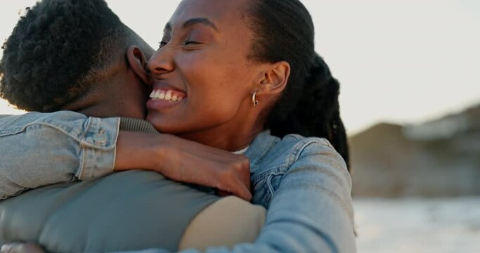 Hug, beach and black couple with love, marriage and vacation with commitment, trust and bonding. Romance, man and woman with relationship, smile and support with seaside holiday, embrace and romantic