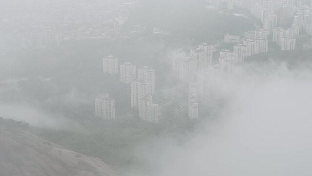 view of Seoul apartments from the fog-filled mountain