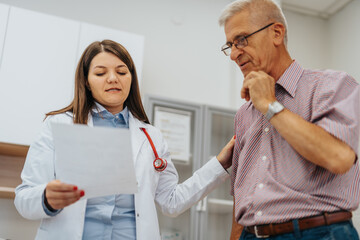 Expert Doctor Analyzing X-Ray Results and Advising Patient in Medical Office