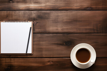 smartphone with notepad and coffee on the wooden table, top view