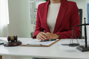 Attorney's office. Goddess of justice with scales and lawyer working on laptop Law, advice and...