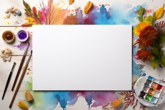 Blank white paper on wooden table with flowers, various tools for painting, brushes, paints, representing concept of idea for drawing background, copy space, top view.