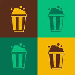 Pop art Popcorn in cardboard box icon isolated on color background. Popcorn bucket box. Vector
