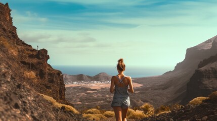 woman turning back fitness in photo of the landscape of the canary islands.