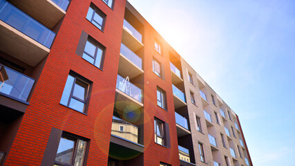 Modern apartment building in a residential area of ​​a city. Contemporary residential building exterior in the daylight. 