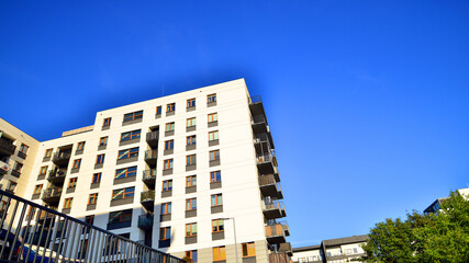 Modern apartment building in a residential area of ​​a city. Contemporary residential building exterior in the daylight. 