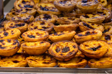 Close-up of Pastel de nata or Pastel de Belém. Ana Portuguese egg custard tart pastry, optionally dusted with cinnamon. Pastéis de nata were created before the 18th century. 