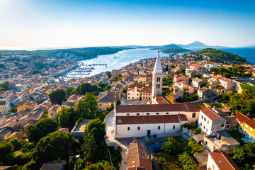 Town of Mali Losinj church and bay aerial panoramic sunset view
