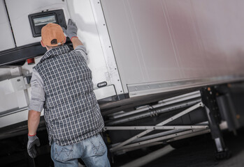 Semi Truck Refrigerated Semitrailer Cargo Temperature Check Performed by a Driver - obrazy, fototapety, plakaty