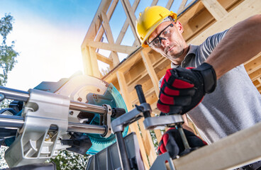 Worker Operating Large Professional Grade Wood Circular Saw