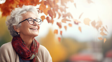 Happy elderly man and woman enjoying the beauty of autumn.