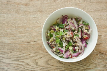 spicy mashed mackerel with herb Thai salad on bowl