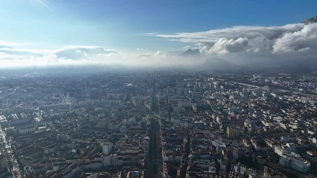 From above, Grenoble unfolds: nestled in Alpine valleys, it's a beacon of innovation and history.
