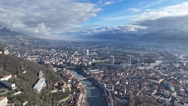 From above, Grenoble unfolds beside the Is&egrave;re River, an Alpine beacon of innovation and history.
